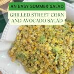 Corn and avocado salad in a white decorate serving bowl on a green check tablecloth