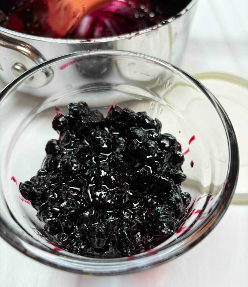 A series of 3 images showing how to cook blueberries and sugar down to make a quick blueberry jam.