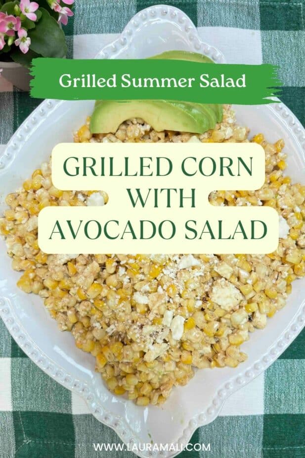 Grilled Street Corn Salad in a deocrative white serving bowl on a green checked table cloth