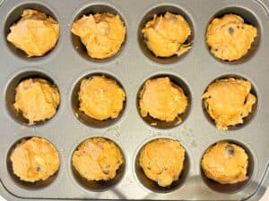 A muffin tin filled with batter