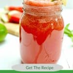 Watermelon Lime Cooler in a clear glass jar on a white picnic table.