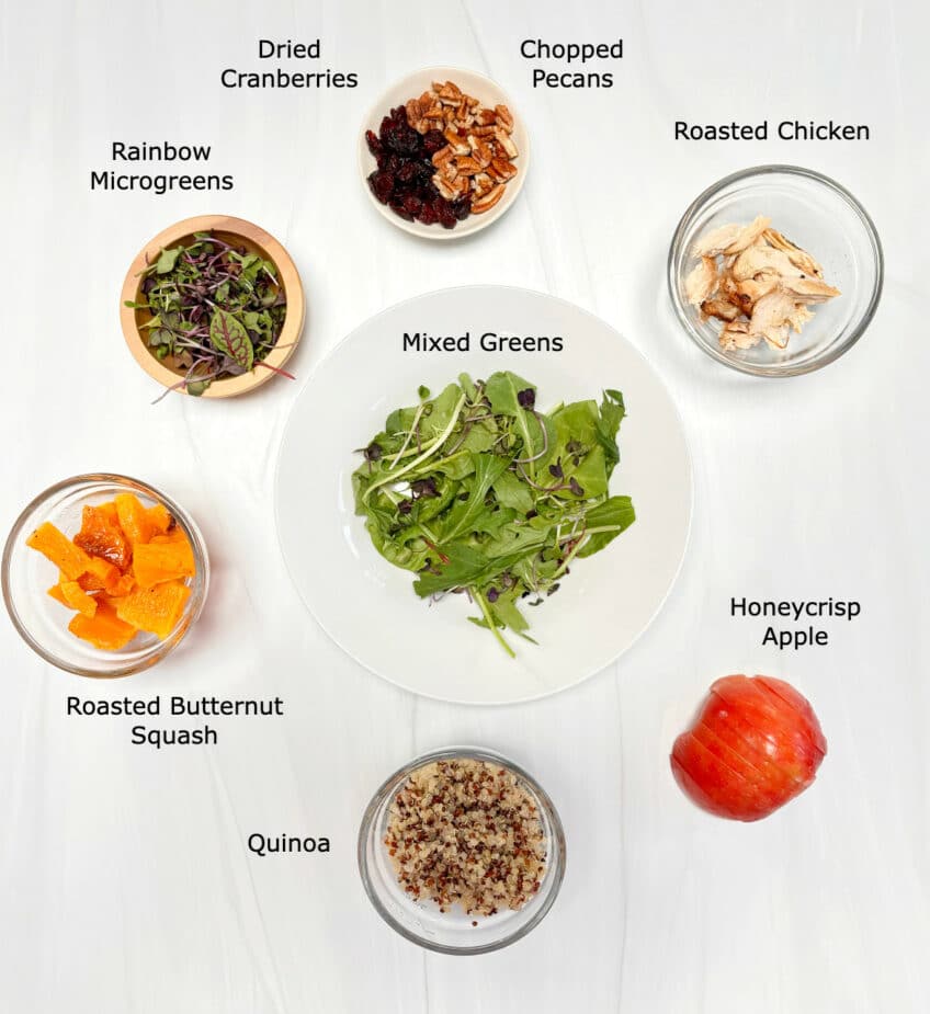 Ingredients to make a Fall Grain Bowl on a marble counter top