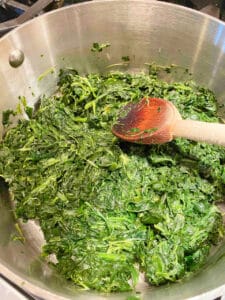 Cooking chopped frozen spinach in a saucepan