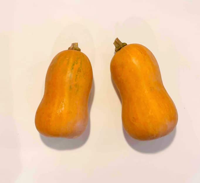 2 Honeynut squash on a white counter