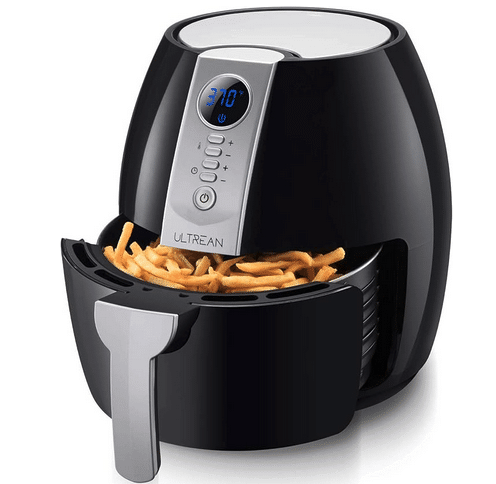 Small air fryer with a basket of french fries