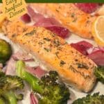 Roasted salmon surrounded by potatoes and broccoli on a sheet pan after cooking