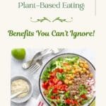 A colorful salad bowl filled with plant-based food on a white table.